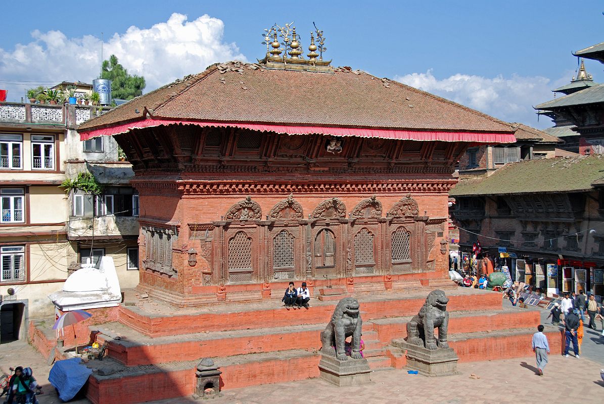 Kathmandu Durbar Square 05 02 Shiva-Parvati Temple The long low building on the northern side of main part of Kathmandu Durbar Square contains a shrine to Shiva and Parvati, who can be seen gazing down from an upper window, posing like a normal couple. The lower part of this late 1700s building is embellished for almost its whole length with a five-bayed carved wooden screen.